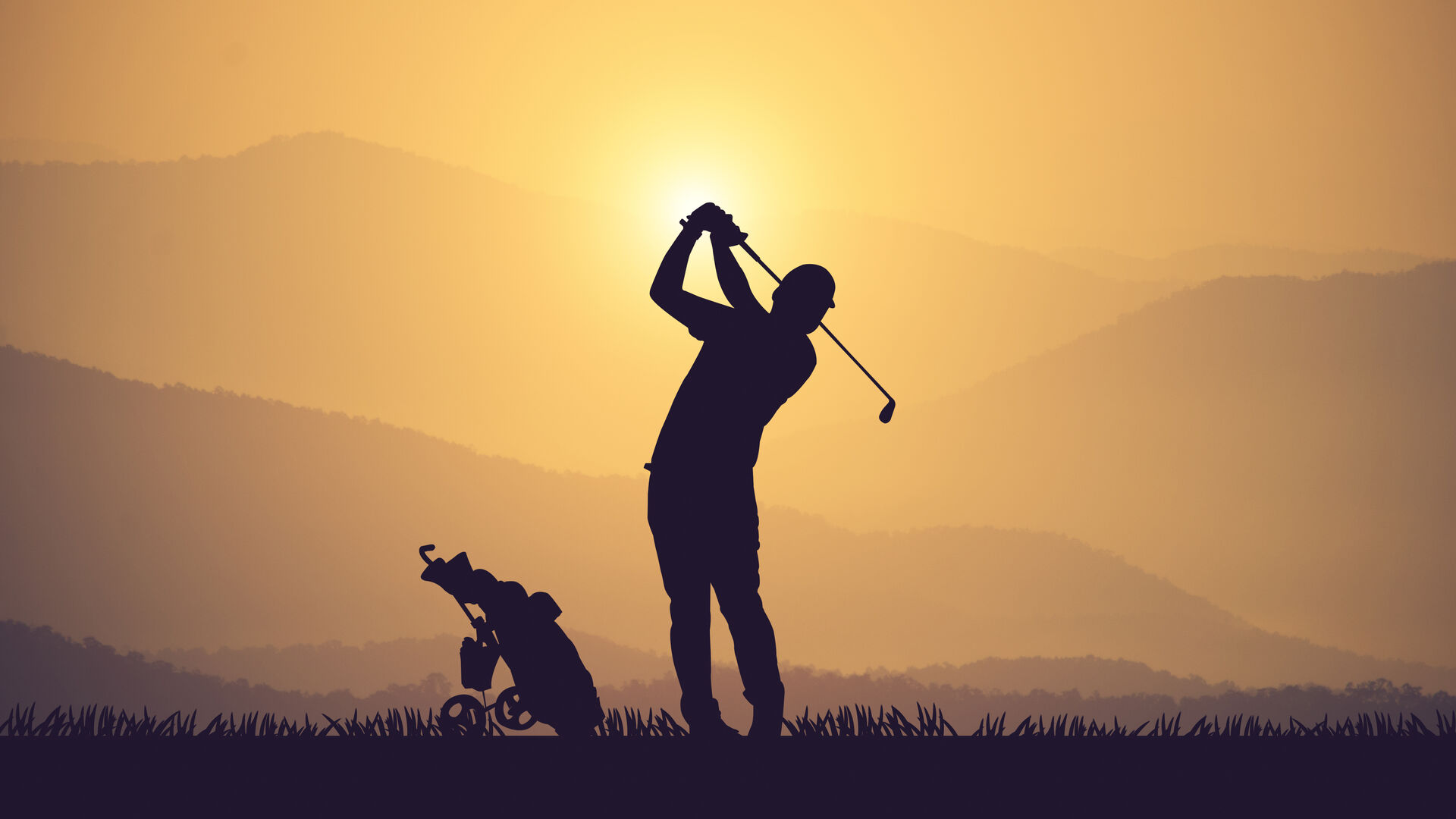 Golfer silhouette at sunset